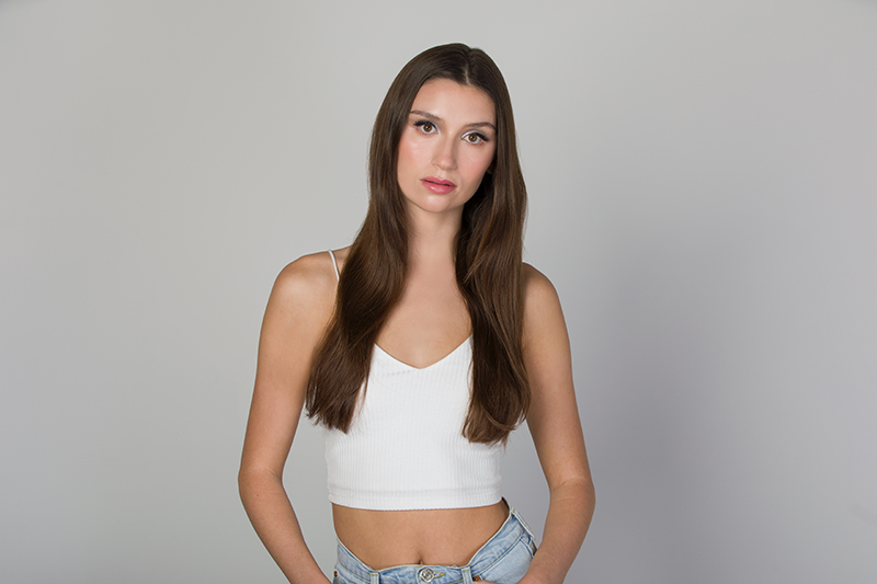 a before image of a brunette female model with long hair