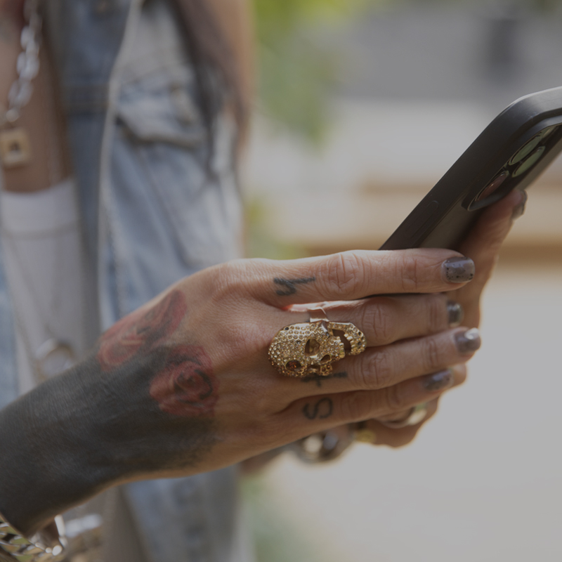 a picture of a hairstylist holding a phone