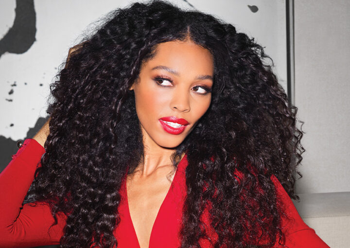 Female model with medium length curly dark hair