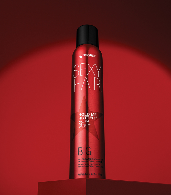 a picture of big sexyhair hold me hotter on a red background