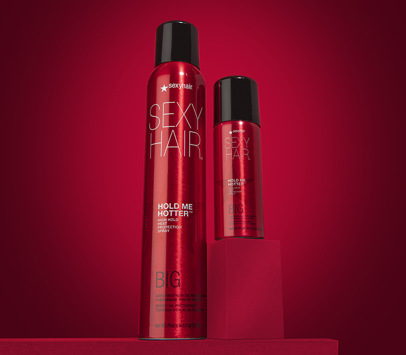 picture of full size and travel size Hold Me Hotter on red background